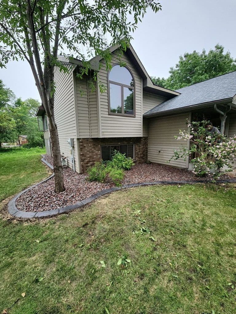 Landscape Renovation with Granite Rock and Charcoal Edging image
